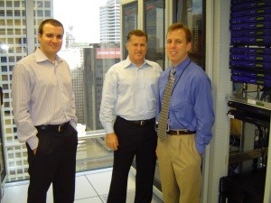 VIRTBIZ President Chris Gebhardt (R) with Kam Ghassemieh (L) and Jimmy Chiles of Aspen Communications